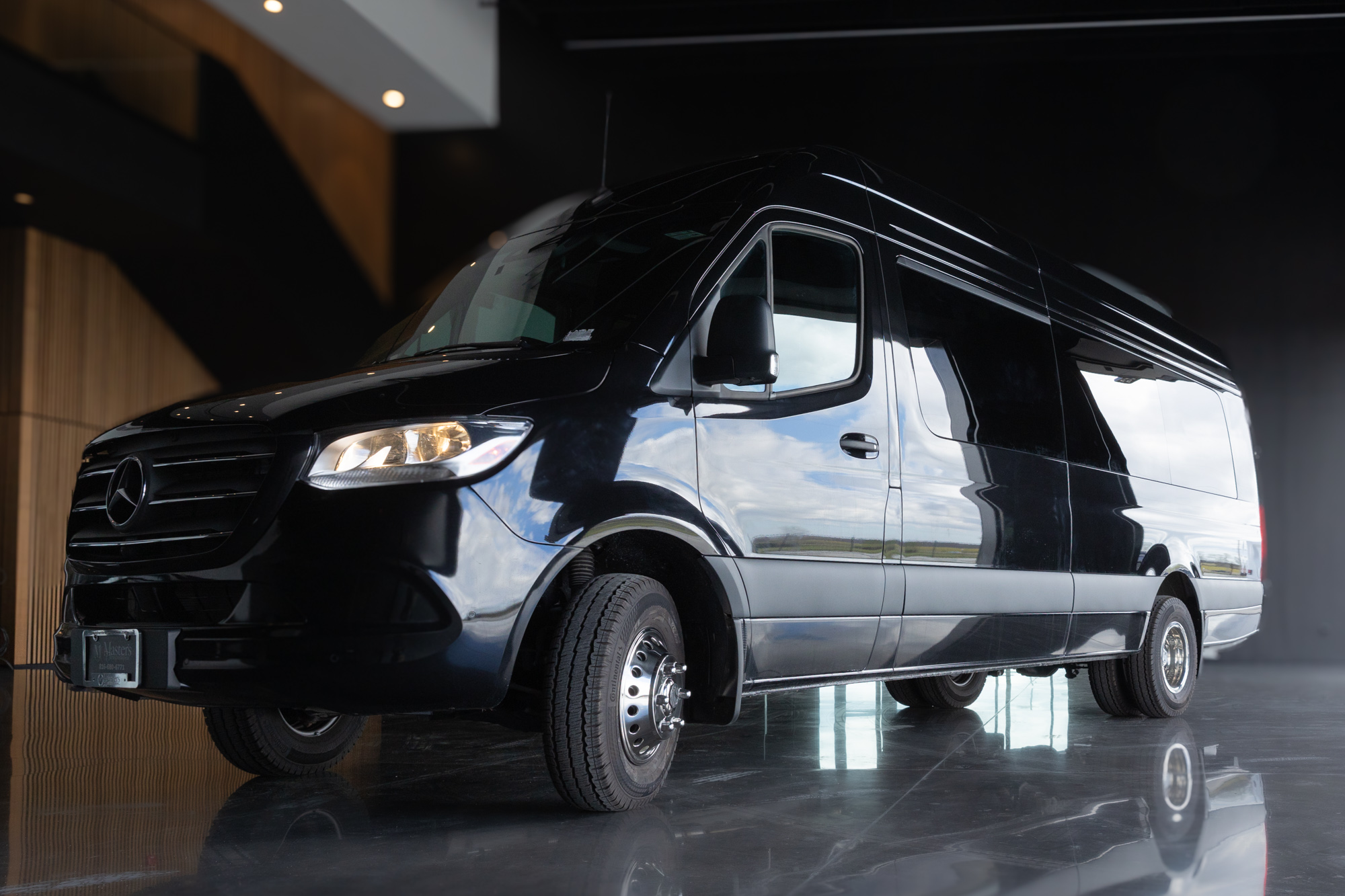 Black Mercedes-Benz Sprinter 14-passenger van — large group shuttle